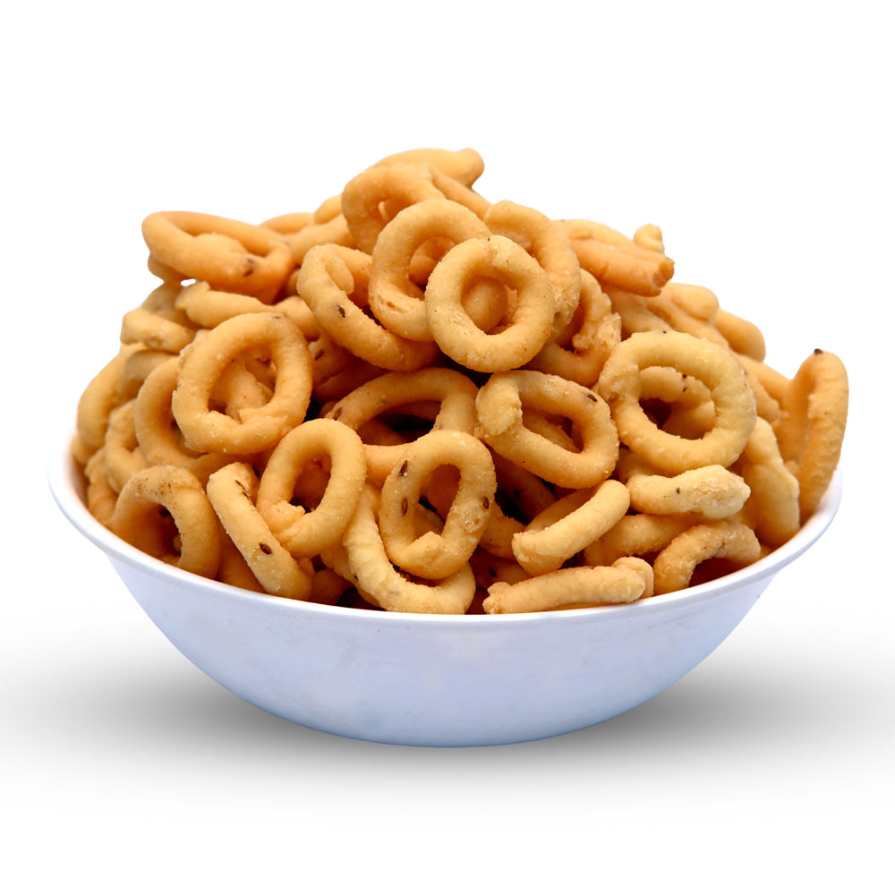 Freshly fried crispy Chakodi snacks arranged in a white bowl, offering the best traditional Andhra taste from Athithi Gruha Foods.