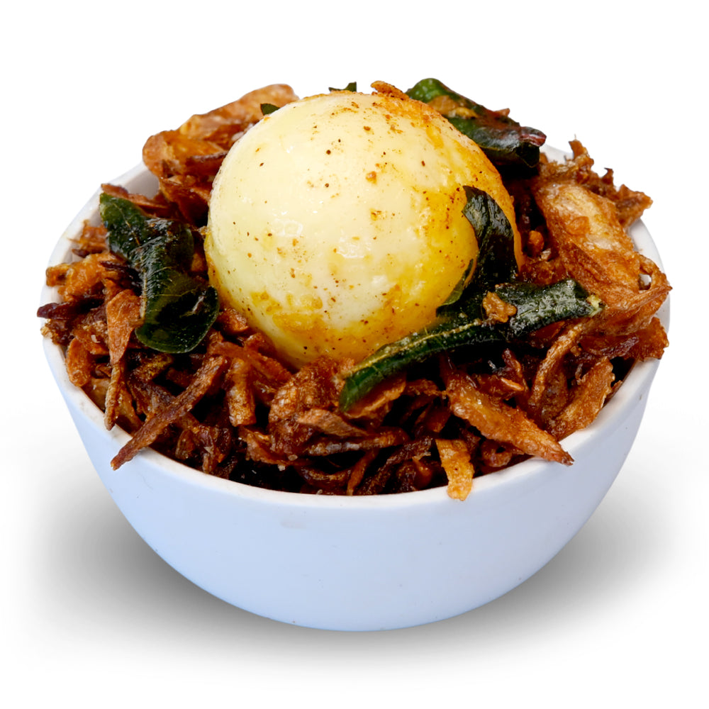 Spicy Andhra egg pickle with boiled eggs in masala
